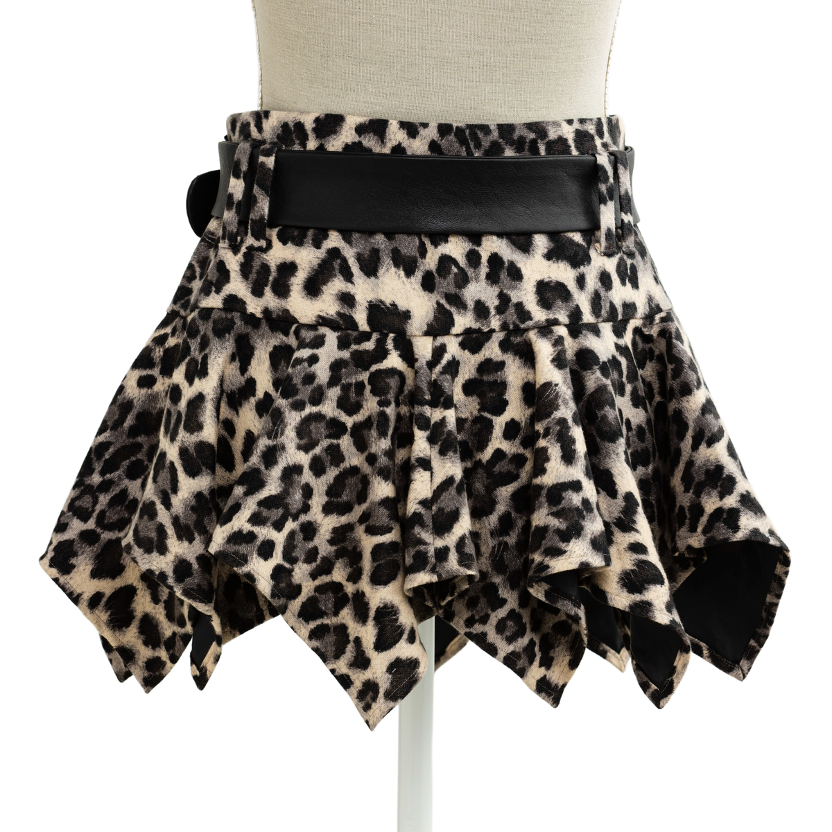 Side view of the leopard print mini skirt with black leather belt