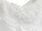 Close up of the lace trim on the white ruffle skirt