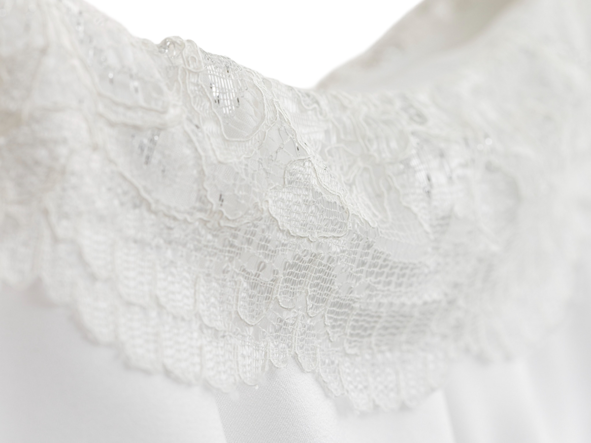 Close up of the lace trim on the white ruffle skirt