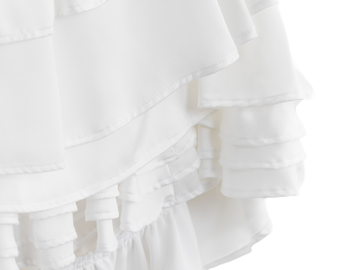 Layered white ruffles on the wedding dress mini skirt