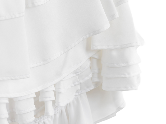 Layered white ruffles on the wedding dress mini skirt