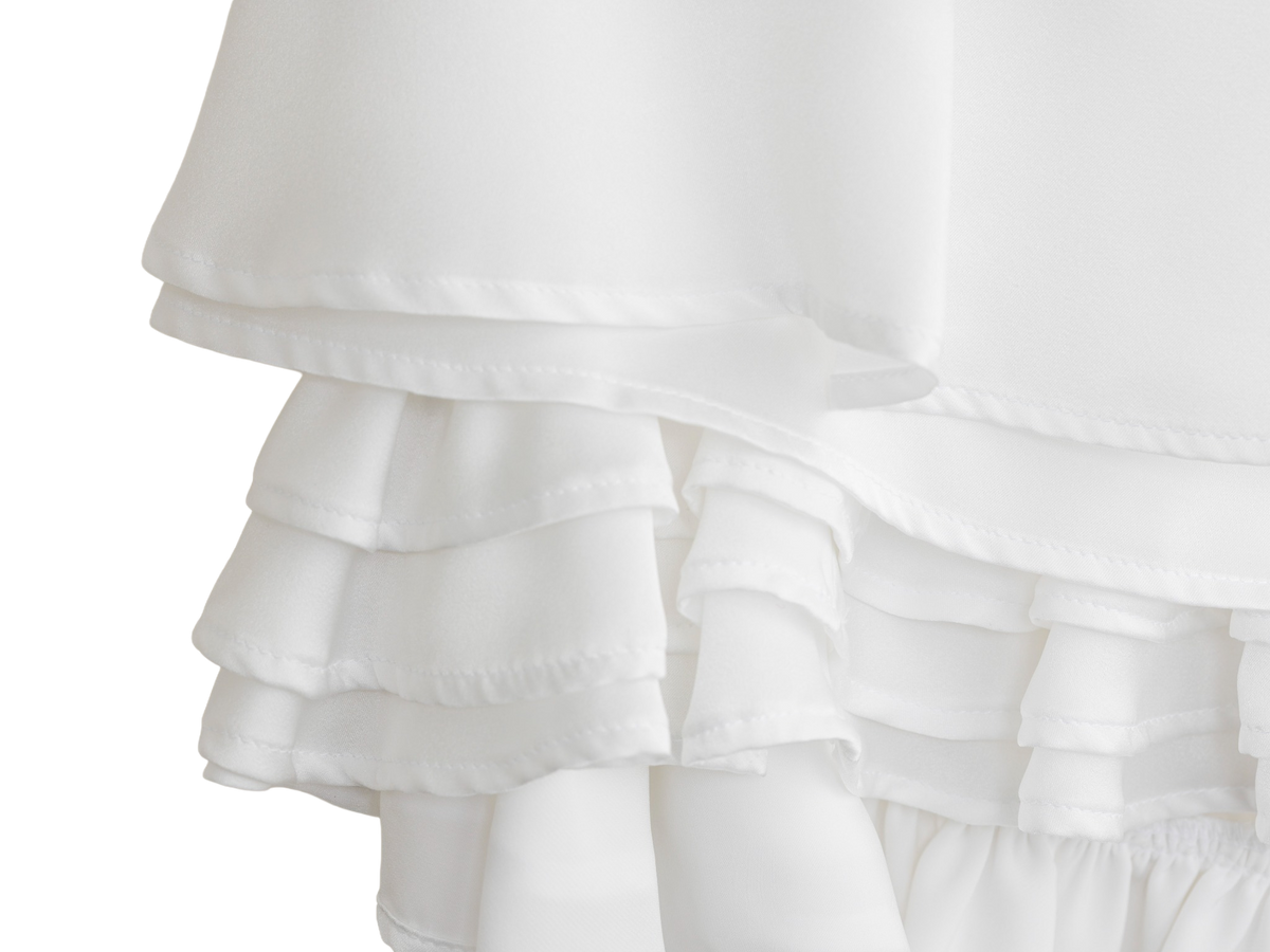 White ruffle mini skirt, fabric and hem detail