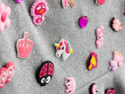 Close up of the removable charms on the grey mini skirt
