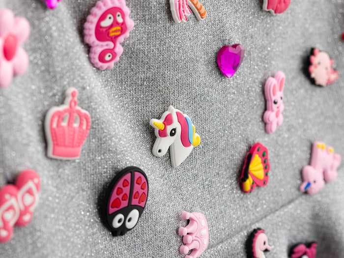 Close up of the removable charms on the grey mini skirt