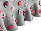 Detail of the ruffle hem and charms on the charm mini skirt
