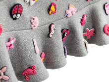 Detail of the ruffle hem and charms on the charm mini skirt