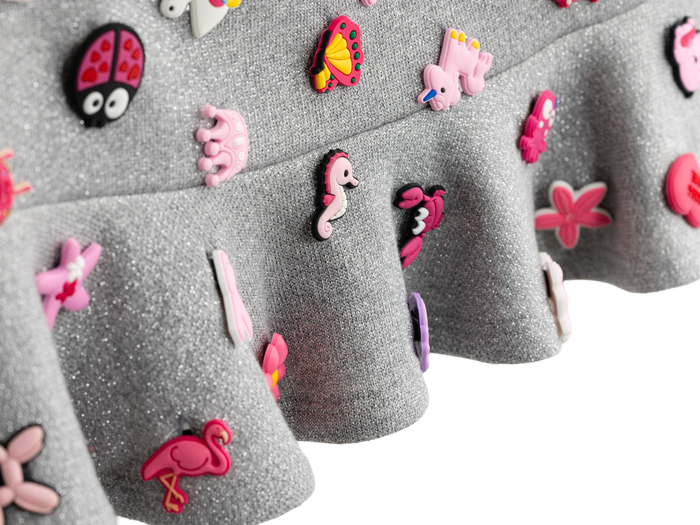 Detail of the ruffle hem and charms on the charm mini skirt