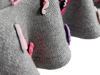 Charm mini skirt detail, pink charms on soft grey fabric