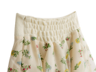 Shirred waist detail on the cream floral mini skirt
