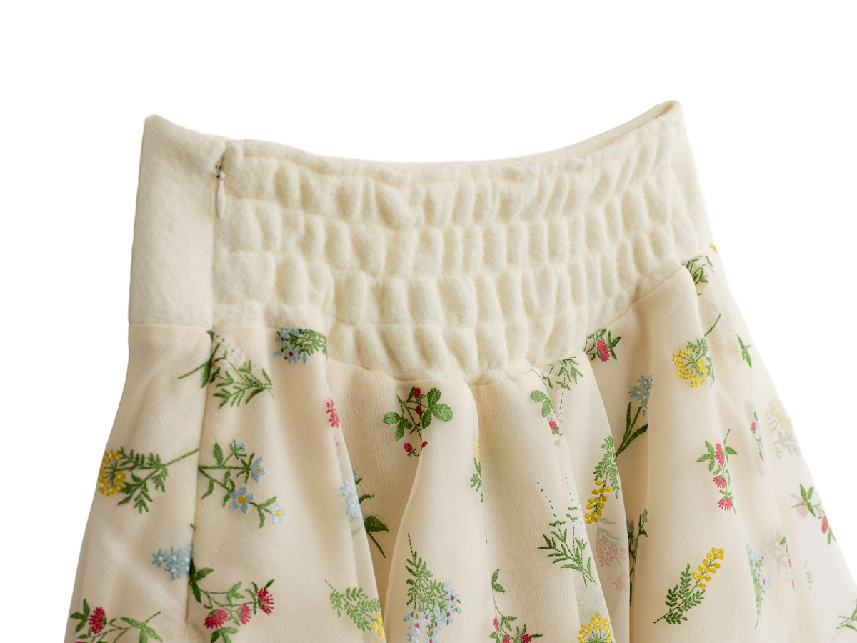 Shirred waist detail on the cream floral mini skirt