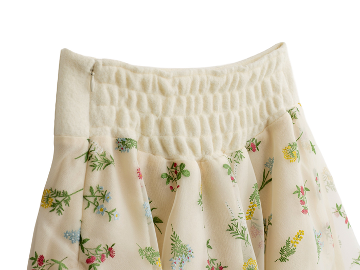 Shirred waist detail on the cream floral mini skirt