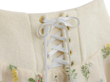 White lace-up front detail on the floral mini skirt