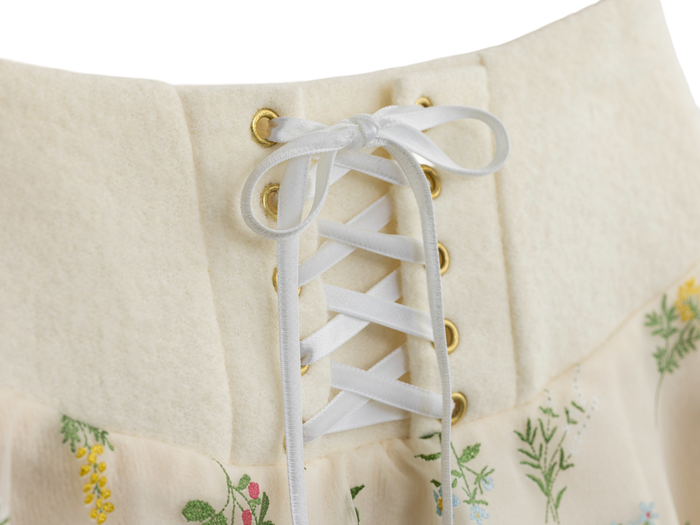 White lace-up front detail on the floral mini skirt