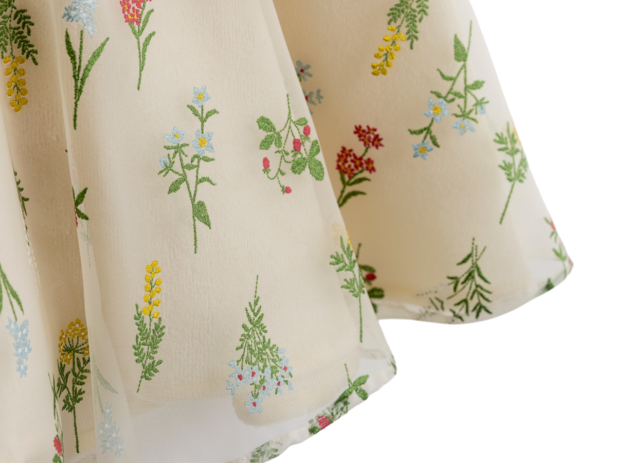 Close up of the wildflower print on cream fabric
