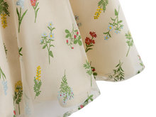 Close up of the wildflower print on cream fabric