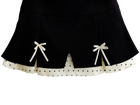 Close up of the polka dot trim on the black mini skirt