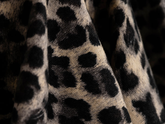 Detail of the rhinestone buckle belt on the leopard print skirt