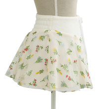 Floral print mini skirt in cream, flared shape on a mannequin