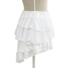 White ruffle mini skirt on a mannequin, princesscore style