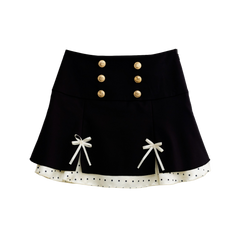 Black polka dot mini skirt with satin ribbon bows, front view