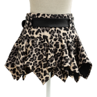 Side view of the leopard print mini skirt with black leather belt
